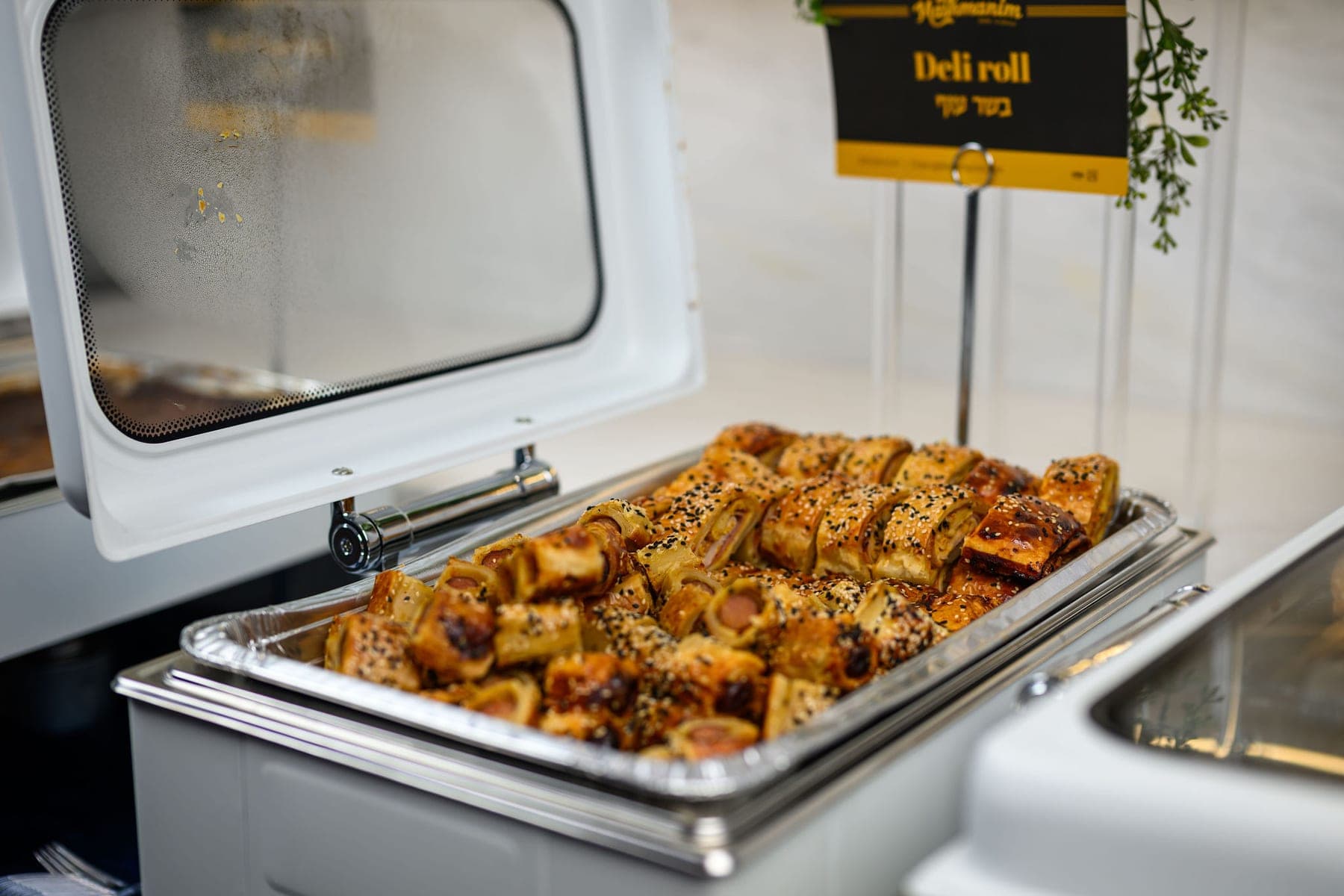 A tray of deli roll under its name card