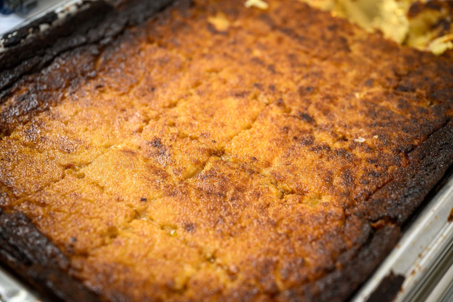 The crust of a kugel across the whole frame